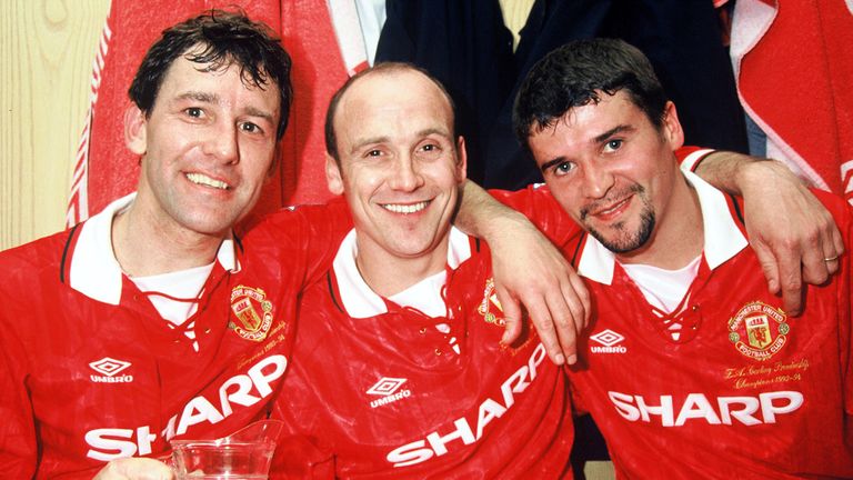 Bryan Robson, Mike Phelan and Roy Keane of Manchester United celebrate with the Premiership Trophy 1993-94