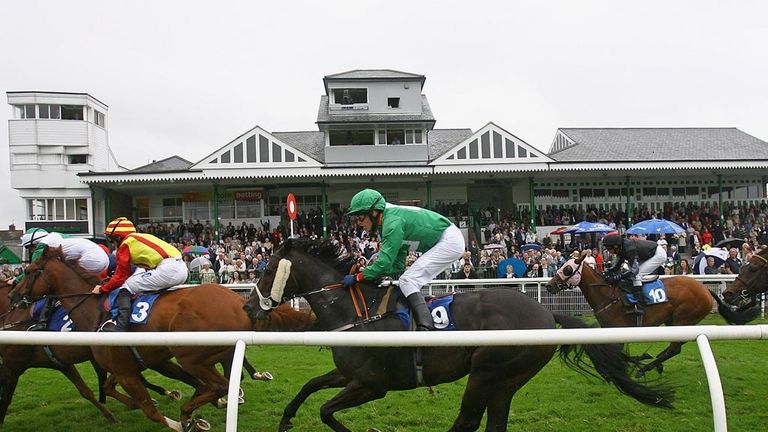 RICHMOND, UNITED KINGDOM - AUGUST 05:  The main stand at Catterick Racecourse is seen as Cheery Cat ridden by Tony Hamilton crosses the finish line during 