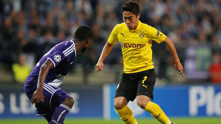 Shinji Kagawa of Borussia Dortmund of Borussia Dortmund takes on Chancel Mbemba of Anderlecht