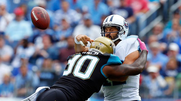 Charlie Whitehurst of the Tennessee Titans is hit by Andre Branch of the Jacksonville Jaguars during week six of the NFL season