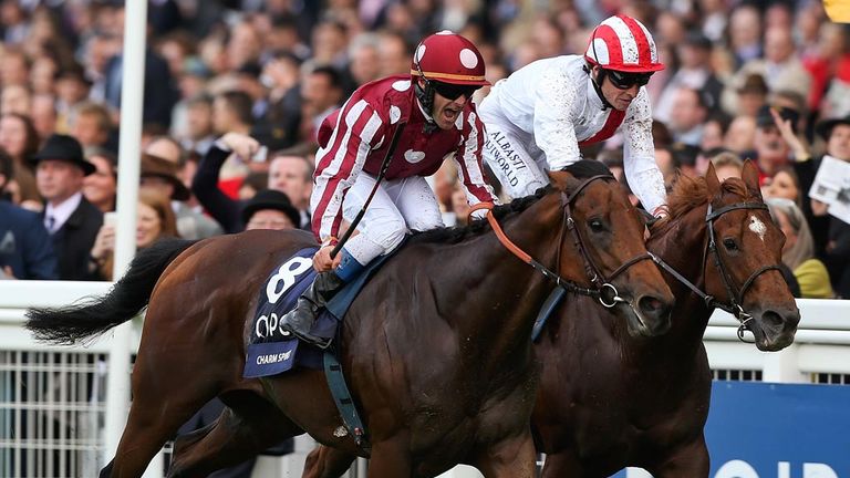 ASCOT, ENGLAND - OCTOBER 18:  Olivier Peslier (L) riding Charm Spirit crosses the finish line ahead of Richard Hughes riding Night of the Thunder to win Th