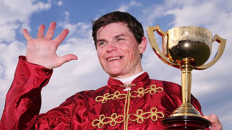 Craig Williams gestures with the Geelong Cup