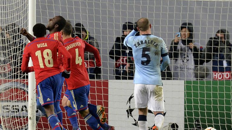 CSKA Moscow's players celebrate after Bibras Natkho scores a penalty - awarded controversially - to level the scores at 2-2