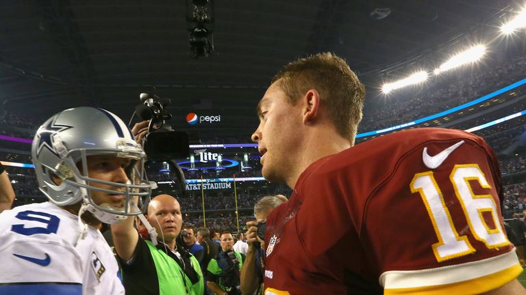 Tony Romo (left) congratulates  Colt McCoy of  Washington after the Redskins win