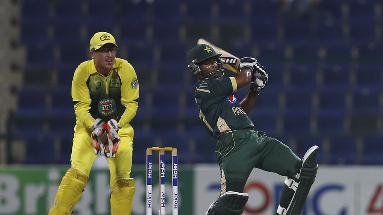 Asad Shafiq of Pakistan bats as Brad Haddin of Australia looks on  during the third match of the one-day series