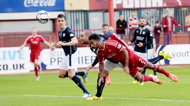 Dundee's James McPake (2nd from right) heads the ball into his own net gifting Aberdeen with the lead