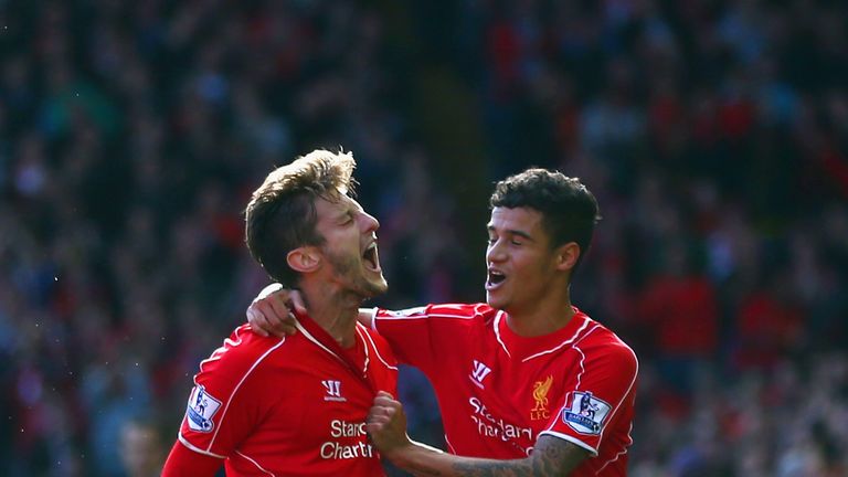 LIVERPOOL, ENGLAND - OCTOBER 04:  Adam Lallana of Liverpool is congratulated by Philippe Coutinho of Liverpool (R) on scoring the opening goal during the B