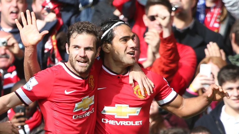 Juan Mata and Radamel Falcao celebrate at Old Trafford on October 5, 2014 in Manchester, England.