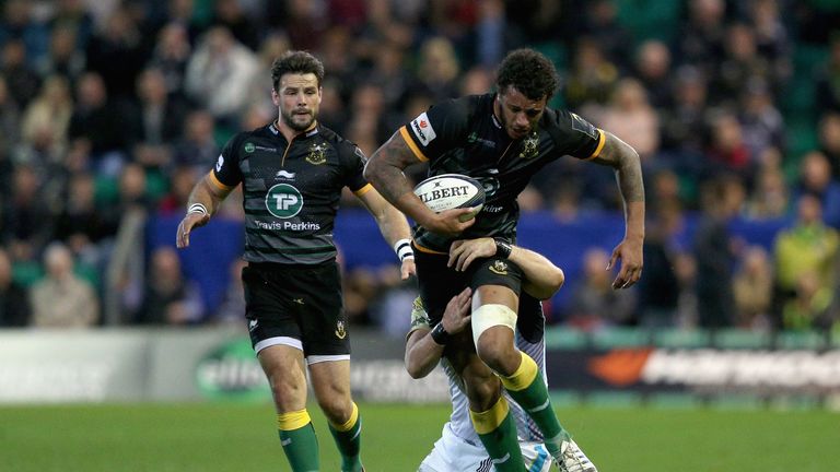 NORTHAMPTON, ENGLAND - OCTOBER 25:  Courtney Lawes of Northampton is tackled during the European Rugby Champions Cup match between Northampton Saints and O