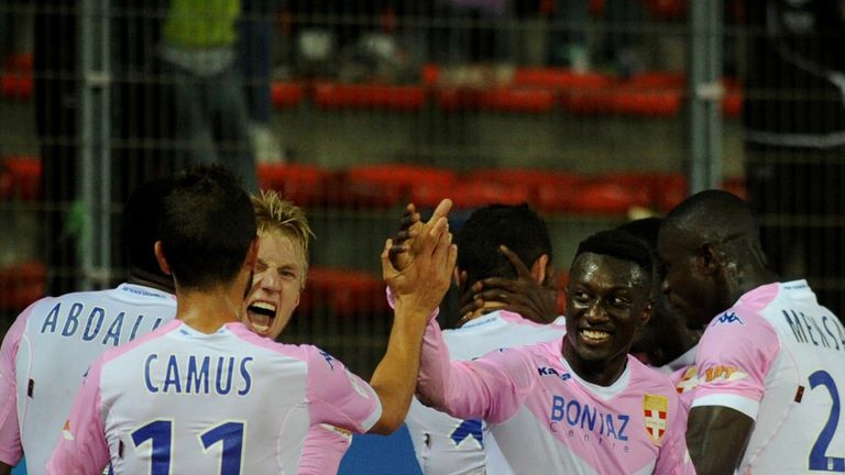 Evian celebrate on their way to a fine victory over Metz