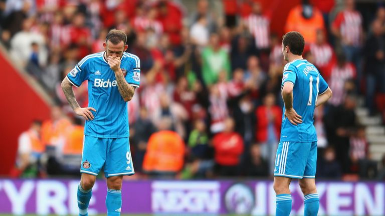 Steven Fletcher and Adam Johnson of Sunderland begin to digest a terrible day for Sunderland - the game finished 8-0 to the Saints