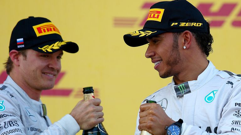 Lewis Hamilton and Nico Rosberg celebrate on the podium
