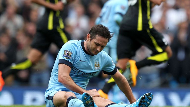 Manchester City's Frank Lampard clutches his thigh during Saturday's win over Tottenham
