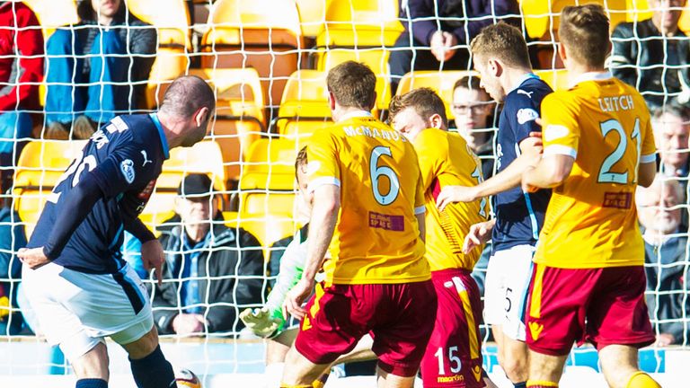 Gary Harkins gives Dundee a two-goal advantage over Motherwell after 30 minutes