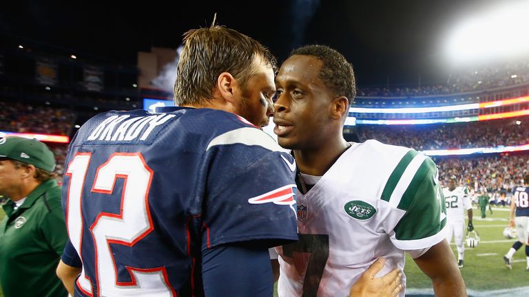 Geno Smith of the New York Jets and Tom Brady of the New England Patriots after a game at Gillette Stadium