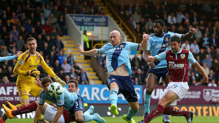 George Boyd of Burnley shoots past James Collins to bring his side back into the game, it's 1-2