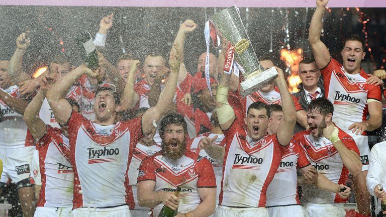 MANCHESTER, ENGLAND - OCTOBER 11:  St Helens captain Paul Wellens lifts the trophy after winning the First Utility Super League Grand Final between St Hele