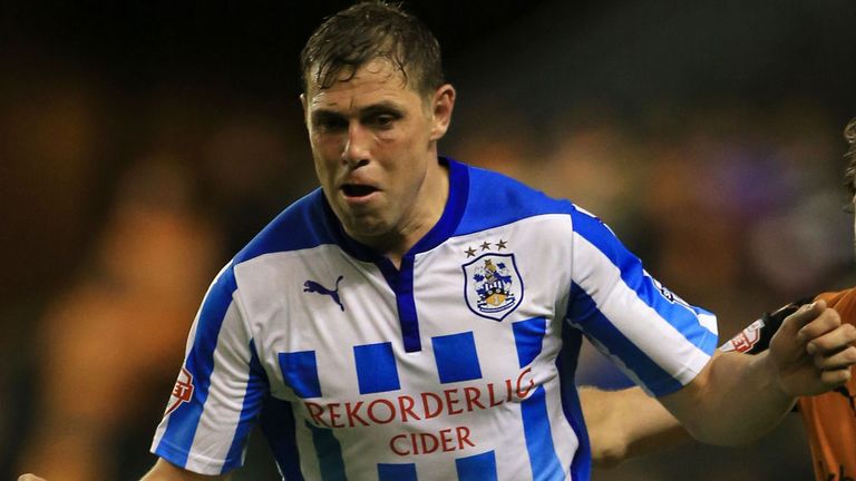 Huddersfield Town's Grant Holt holds off a challenge from Wolverhampton Wanderers' Richard Stearman (right), during the Sky Bet Championship match at the M