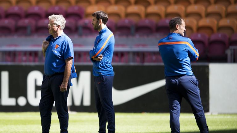 Netherlands national football team's coach Guus Hiddink (L) and his assistants Ruud van Nistelrooy (C) and Danny Blind