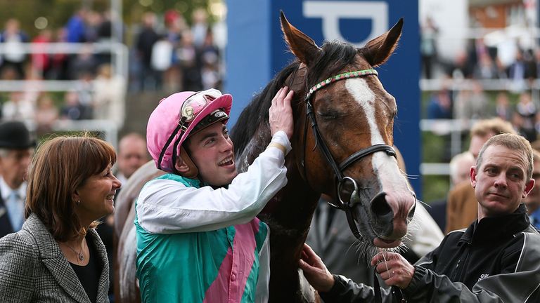 ASCOT, ENGLAND - OCTOBER 18:  Lady Jane Cecil (L) and James Doyle celebrate with Noble Mission after winning The Qipco Champion Stakes at Ascot Racecourse 