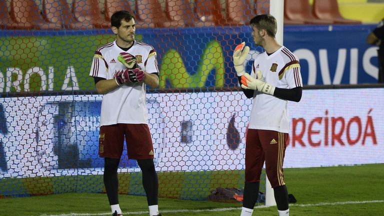 Spain goalkeeper and captain Iker Casillas (L) and Spain's goalkeeper David de Gea chat during a training session at the Ciudad de Valencia stadium