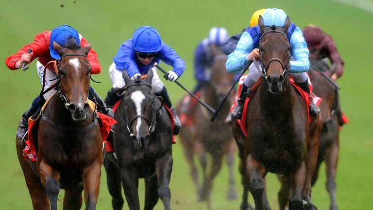 Ryan Moore on Integral (left) wins The Kingdom of Bahrain Sun Chariot Stakes during Tattersalls Millions Day at Newmarket Racecourse, Suffolk.