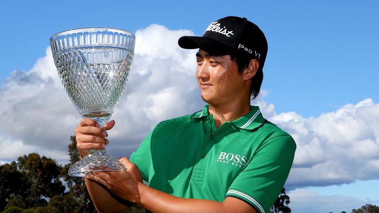 Jin Jeong of Korea holds aloft the trophy after taking victory last year