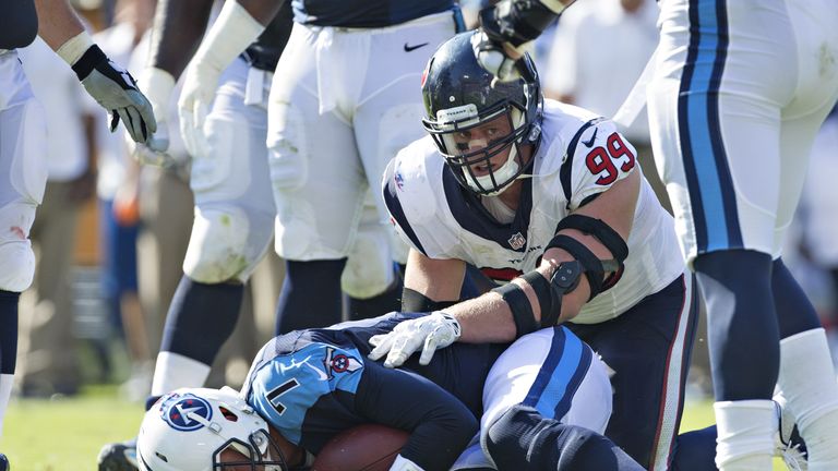 JJ Watt #99 of the Houston Texans sacks Zach Mettenberger #7 of the Tennessee Titans