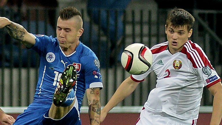 Slovakia's Juraj Kucka fights for the ball with Belarus' Stanislav Dragun 