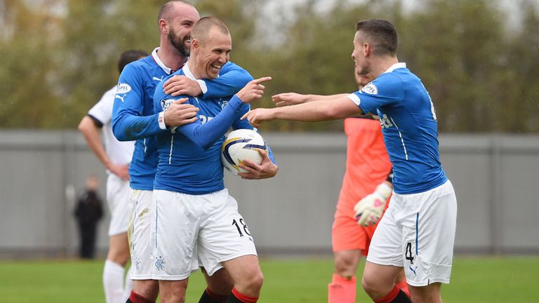 Kenny Miller (with ball) celebrates after firing Rangers ahead in the 26th minute at Dumbarton 