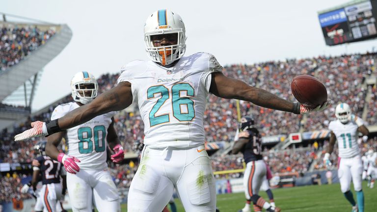 Lamar Miller of the Miami Dolphins celebrates his touchdown during the third quarter against Chicago Bears 