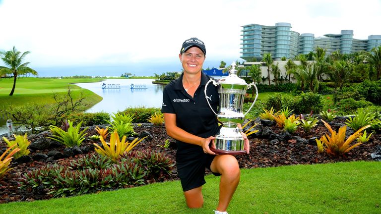 Lee-Anne Pace of South Africa holds her Blue Bay LPGA trophy after a day-five victory