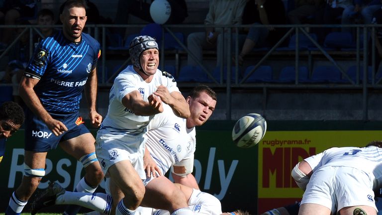 Leinster's scrum-half Isaac Boss spins out a pass