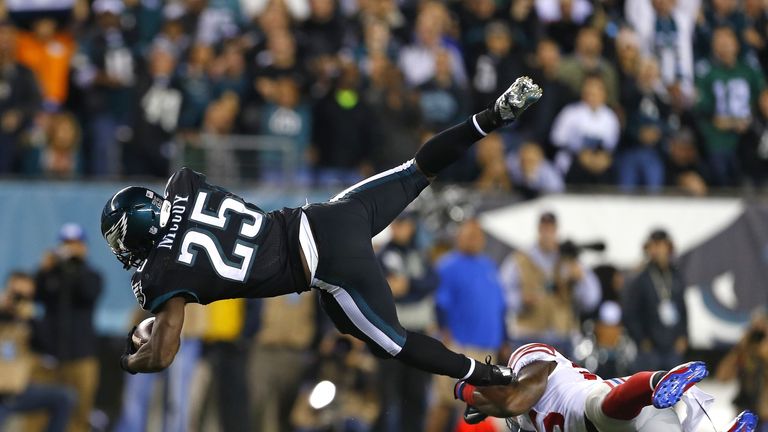 LeSean McCoy of the Philadelphia Eagles is hit by Antrel Rolle of the New York Giants