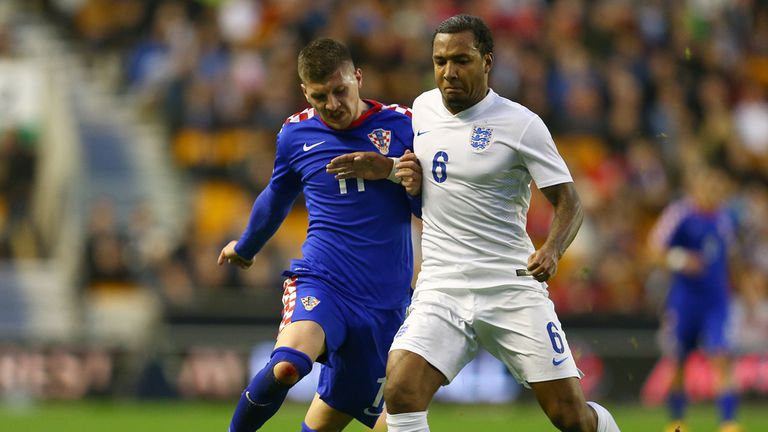 Liam Moore is put under pressure by Ante Rebic 