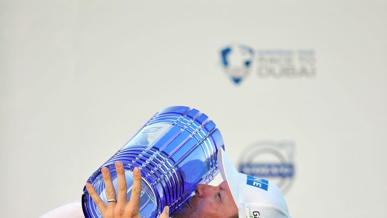 Finnish golfer Mikko Ilonen kisses the trophy after beating Swedish golfer Henrik Stenson in the final of the Volvo World Match Play Championship at The Lo