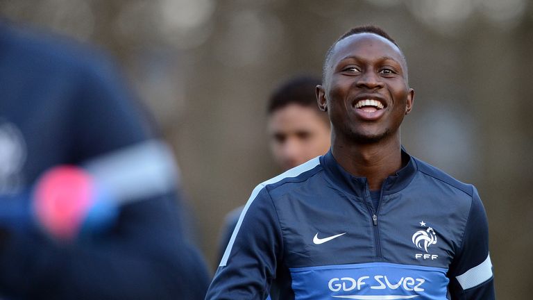 France national football team midfielder Mapou Yanga Mbiwa smiles before a training session in Clairefontaine-en-Yvelines, near Paris, on March 18, 2013