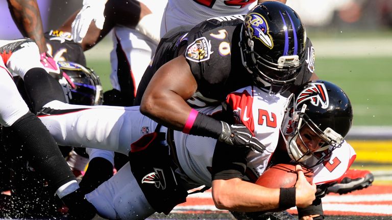 Matt Ryan (No 2) of the Atlanta Falcons is sacked in the second quarter by outside linebacker Elvis Dumervil (No 58) of the Baltimore Ravens