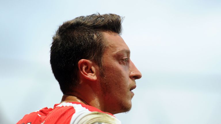 Mesut Ozil of Arsenal during the Barclays Premier League match between Arsenal and Tottenham at Emirates Stadium on September 27, 2014 in London, England