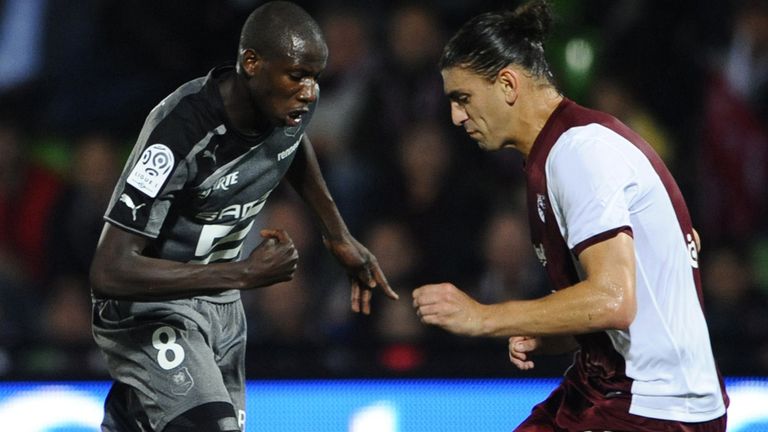 Metz defender Guido Milan (right) vies for the ball with Rennes' Abdoulaye Doucoure