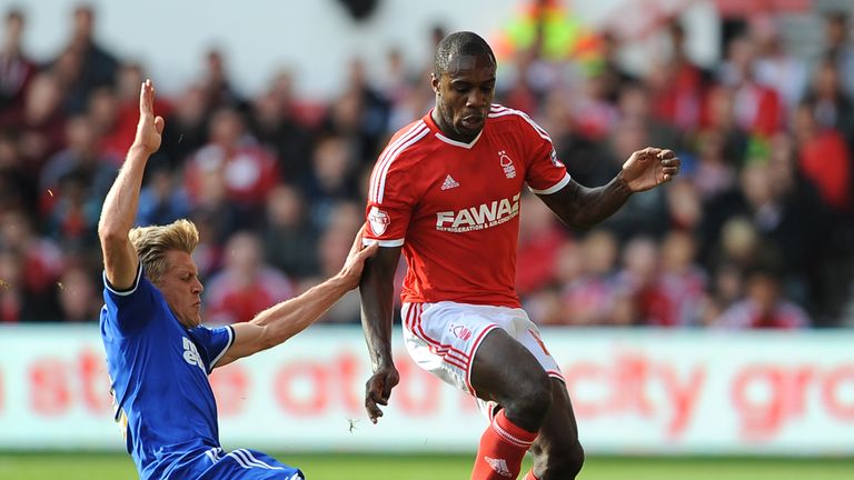 Michail Antonio is tackled by Jonathan Parr