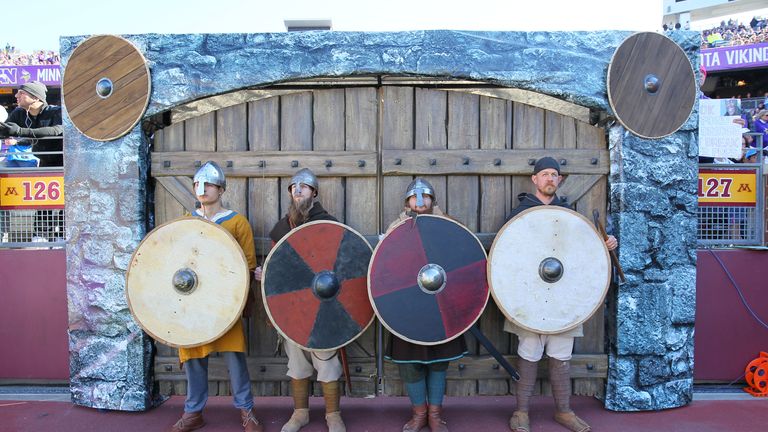 Minnesota Vikings introduction performers pose on the field before the game against the Detroit Lions