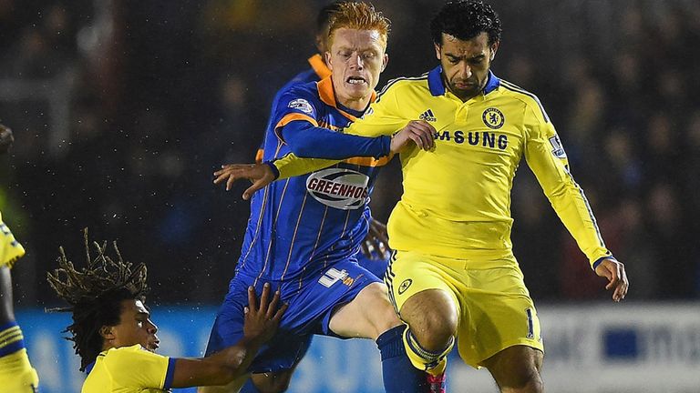 Nathan Ake (left) and Mohamed Salah of Chelsea close down Ryan Woods of Shrewsbury