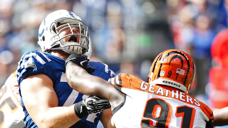 Anthony Castonzo of the Indianapolis Colts blocks Robert Geathers of the Cincinnati Bengals