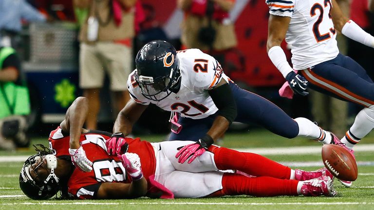Ryan Mundy of the Chicago Bears breaks up a pass reception by Roddy White of the Atlanta Falcons at THE Georgia Dome