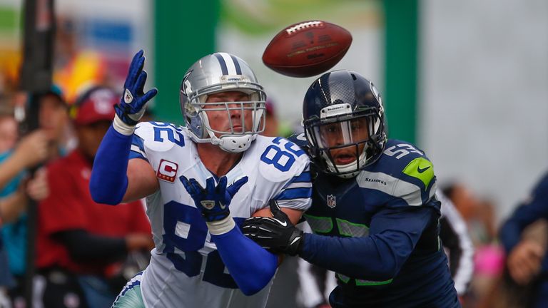 Tight end Jason Witten of the Dallas Cowboys tries to make a catch against linebacker Malcolm Smith of the Seattle Seahawks