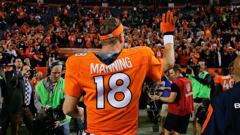 DENVER, CO - OCTOBER 23:  Quarterback Peyton Manning #18 of the Denver Broncos waves to fans as he walks off tyne field after a 35-21 win over the San Dieg
