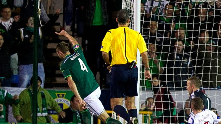 Northern Ireland's Gareth McAuley scores during the UEFA Euro 2016 qualifying match at Windsor Park, Belfast.