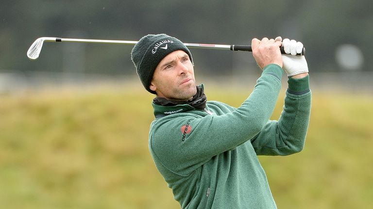Oliver Wilson of England plays his second shot on the fouth hole during the third round of the 2014 Alfred Dunhill Link