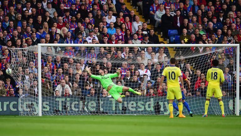 LONDON, ENGLAND - OCTOBER 18:  Goalkeeper Julian Speroni of Crystal Palace dives, but fails to stop Oscar of Chelsea (not pictured) scoring their first goa